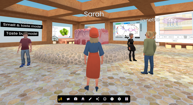 A Frame VR screen image showing four people in a tutorial room with a 3D model of a cross-section through a tongue and some posters.